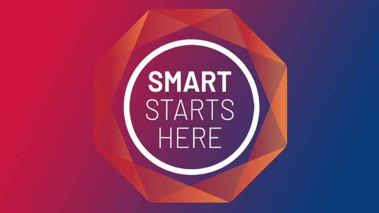 以红蓝垂直渐变色为背景的 Smart Starts Here 标志