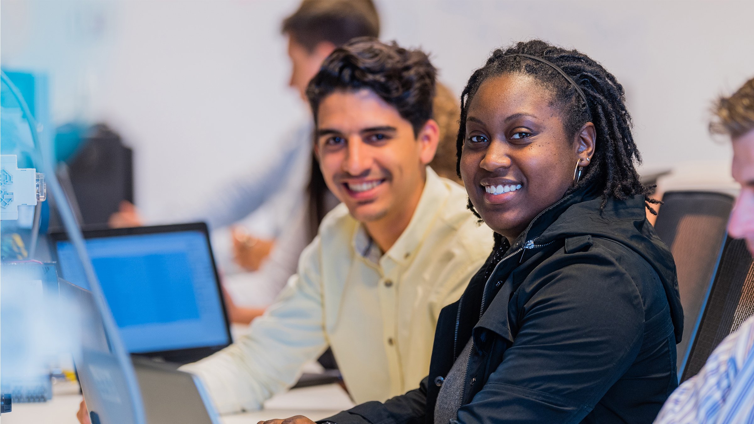 two students using training workstations to learn new technologies