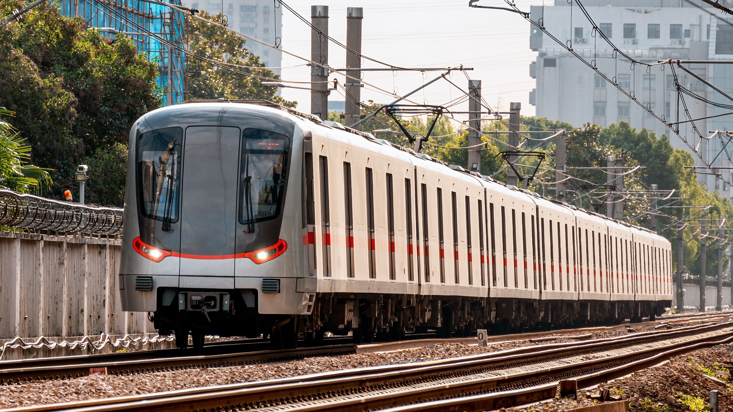A subway train running on ground tracks in Shanghai, China.