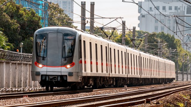 A subway train running on ground tracks in Shanghai, China.